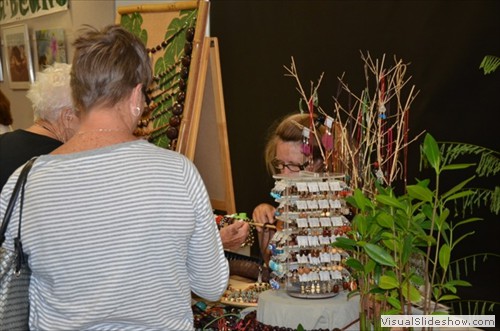 Nan Rhodes, www.BeachBeans.com, hiding behind her wares.