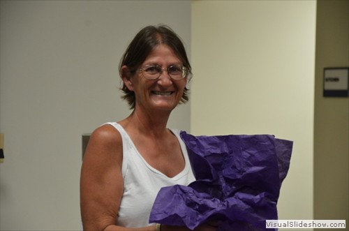 Sherry Havard, raffle winner of the glass ball.